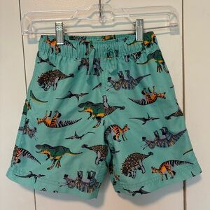 Hanna Andersson dinosaur print teal swim trunks, size 6-7, EUC